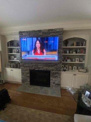 TV INSTALL OVER FIRE PLACE WITH FLAT TILT BRACKET.