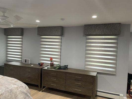 Designer Banded Shades with PowerView automation under upholstered cornices.