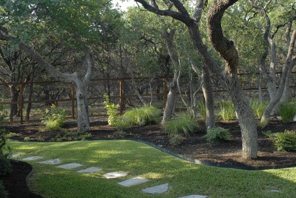 Custom designed landscaping by Landscapes of Texas.