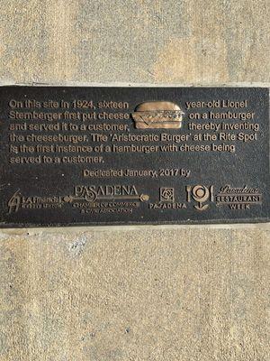 The Birthplace of the Cheeseburger. A bronze plaque on the ground @ the former Rite Spot in Pasadena. In 1924 Lionel Sternberger created it.