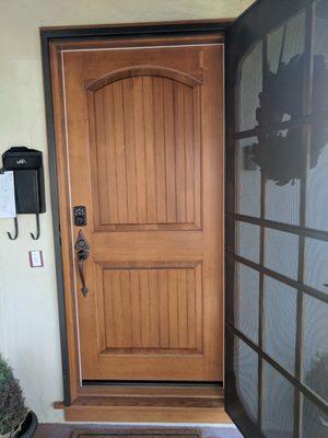 Front door Finish is Early American solid wood Simpson door