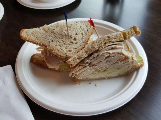 Pure Bliss sandwich with fresh turkey, brie, sliced Granny Smith apples and house made dijon!