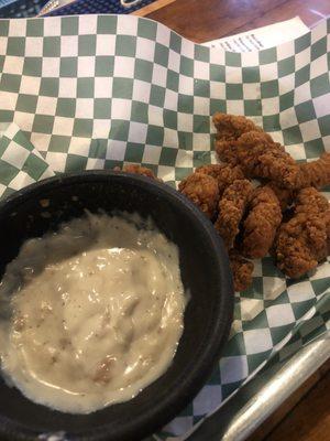 Angus bites with gravy. They are basically the fried steak version answer to chicken tenders.