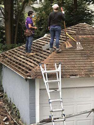 Luis and his crew had to remove the shingles and the old rotting plywood before rebuilding our garage roof.