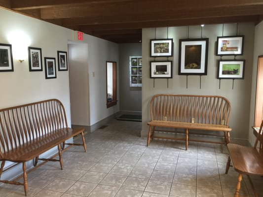 Waiting area with photos of cats and dogs that have been patients