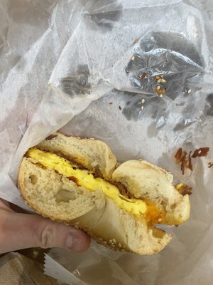 Half eaten bacon egg and cheese