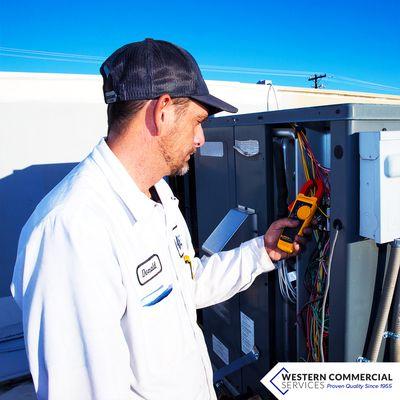 Our Refrigeration tech working on the roof of a client.