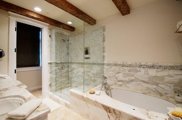 These antique timber beams look terrific in this contemporary bathroom.