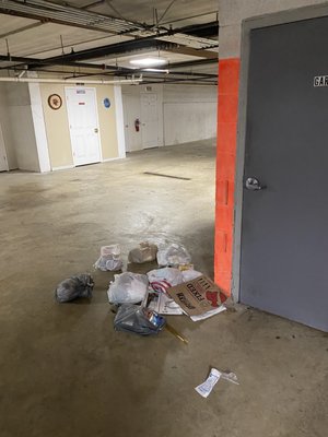 Garbage that falls to the floor when the dumpster is removed for emptying, stays on the floor.