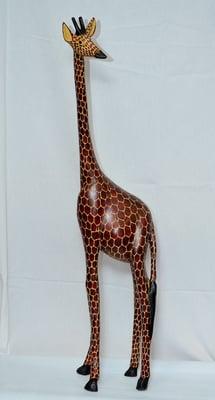 The coolest giraffe in the world. A 7-foot work of art hand-carved by a talented Kenyan artist.