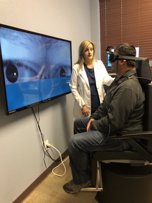 Dr. Hinrichs performing vestibular testing on a dizzy patient.