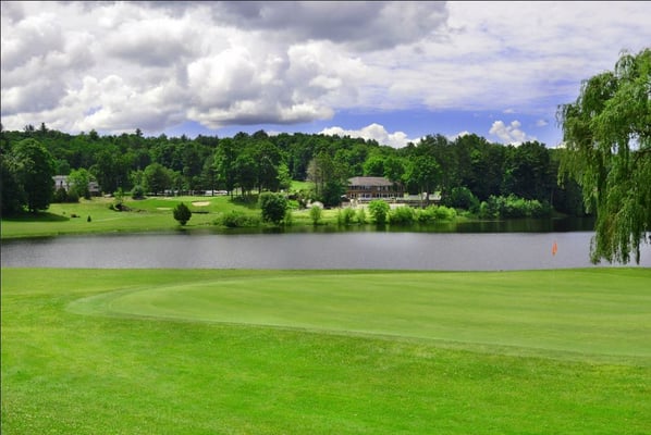 1st green with clubhouse in the distance