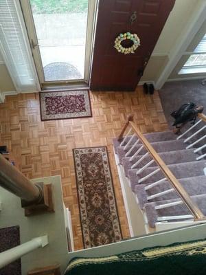 Entryway: FCI refinished our floors and a glimpse of the  carpeting up the stairs. Carpet was laid in diningroom and familyroom.