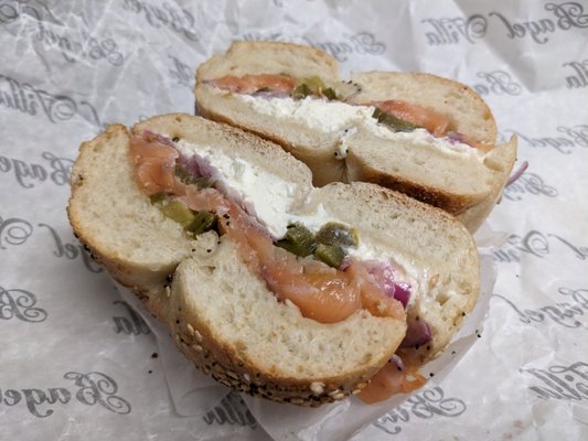 Everything bagel with cream cheese, lox, onions, and jalapenos