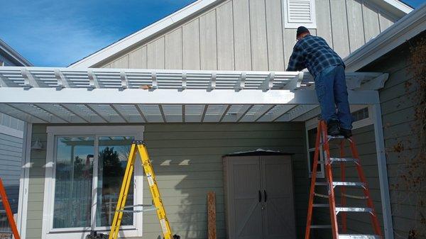 back pergola over cement porch.