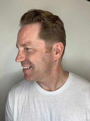 Men's medium length, layered haircut.