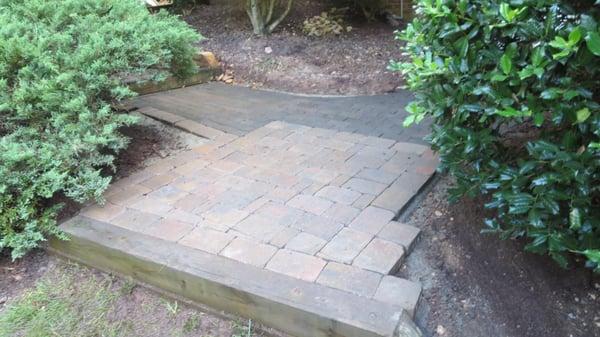 Raised all brick so no more standing water on walkway. New bricks added