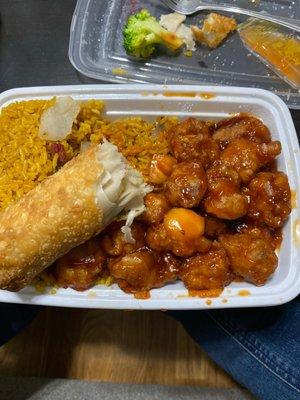 Orange chicken combo with undercooked raw dough spring roll