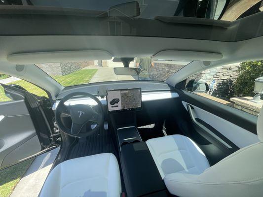 Interior cleaning and restored white seats go original color on Tesla Model Y