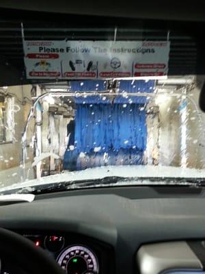 You get to sit in your car as they prewash and send you through the machine