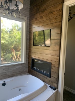 Tv and fireplace over tub