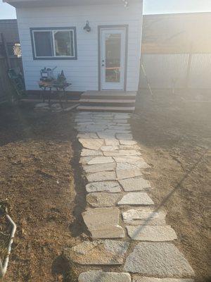 Stone walkway to the she shed. Bill and the guys were awsome helping out and gave great info. My wife did it all by herself.