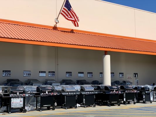 Storefront with a large display of outdoor barbecue grills!