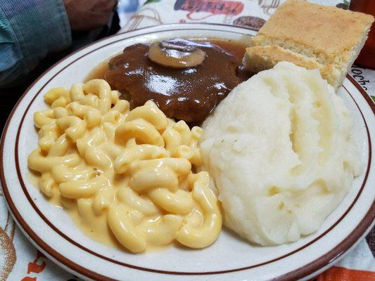 Chopped steak and gravy, mac and cheese, and  mashed potatoes