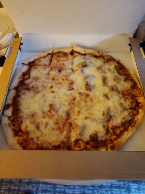 Large one topping half cheese half sausage pizza.