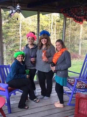 Guests enjoying the screened porch overlooking the private pond.