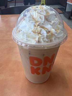 Caramel iced coffee with whip cream.