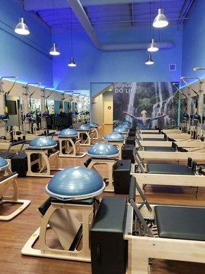 Main studio with 12 reformers,  EXO chairs,  Bosu balls,  boxes,  wall mounted Springboards,  TRX straps,  Barre, etc.