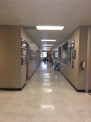 Administrative Offices lined with school history timeline and graduating class photos