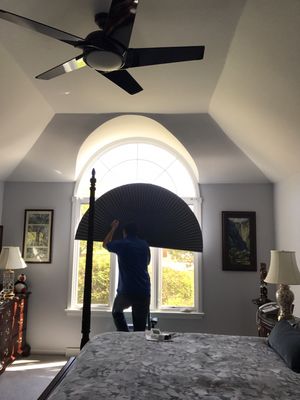 Co-Owner Jon Franzone Preparing to install a Duette Honeycomb Shade Room Darkening Arch in Winfield IL