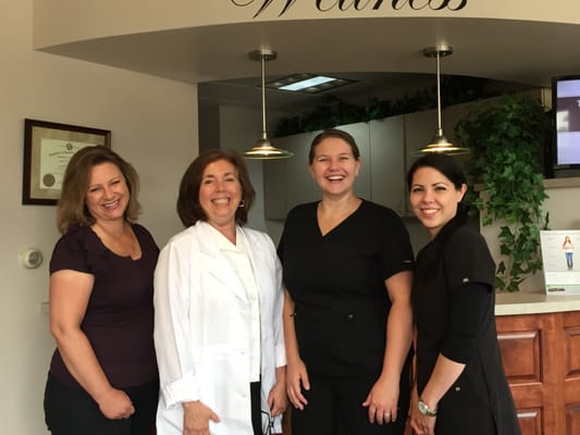 Meet the staff! From left to right: Katie (office business assistant), Dr. Settimi, Tara (office manager), and Jen (chiropractic assistant)