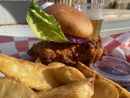 Fried chicken sandwich w/ potato wedges.