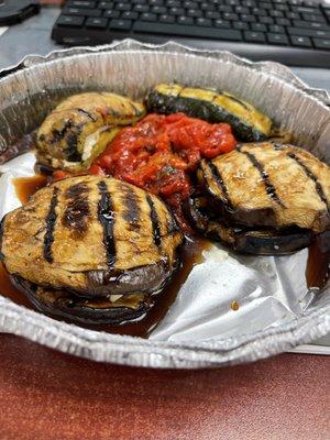 A6 Antipasti. Grilled eggplant and zucchini stuffed with goat cheese with roasted peppers and fig glaze. comes with fresh pita.