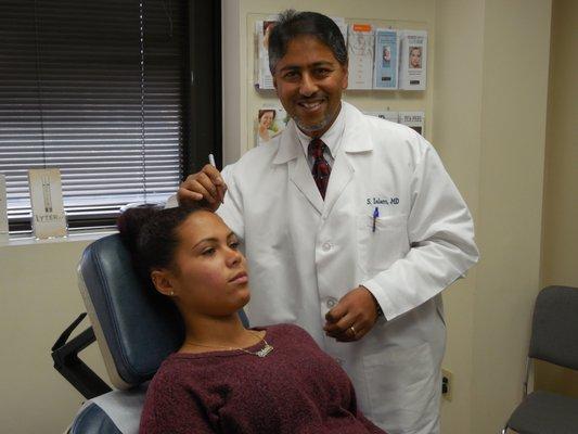 Dr. Sohel Islam with a patient.  Dr. Islam is a Cosmetic, Plastic, Reconstructive and Hand surgeon.