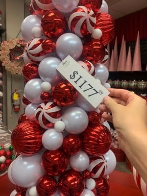 $1117 for a styrofoam cone (approx 4ft) with plastic ornaments stuck on. That's a steep markup for a fairly simple DIY