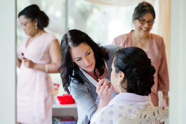 Applying makeup to a bride on her special day