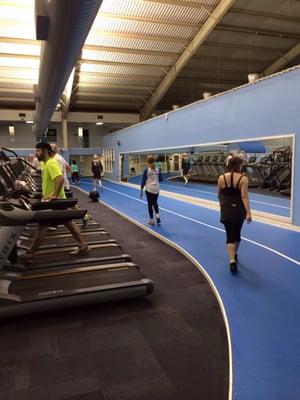 one indoor banked track down in the fitness machine area. Indoor pool off to the right behind the mirror wall.