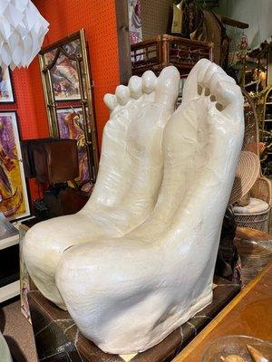 Look at this wonderfully disgusting foot chair.