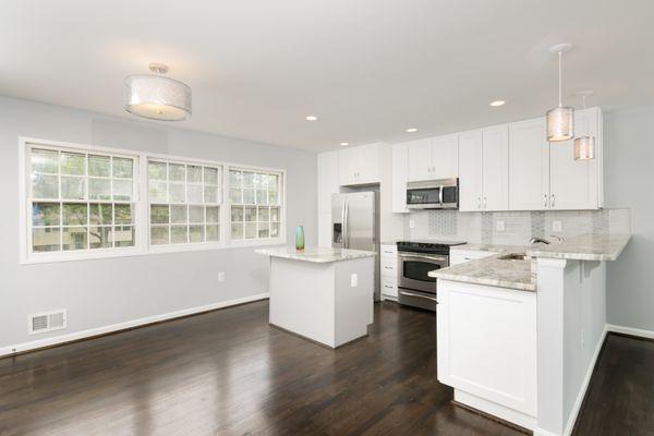 This remodel was done on an old 1970 Alexandria kitchen that was dated.  We gutted it, removed the walls put in new cabinets, countertops, a