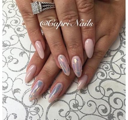 Gel manicure on natural nails with glass effect.