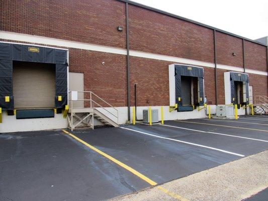 Outside view of three truck high docks at Suites E,F at 822 James Record Road Huntsville, AL