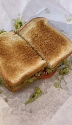 Avocado toast with tomatoes.