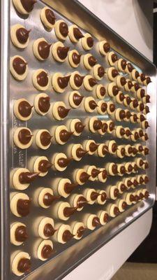 Here are our mini alfajores or caramel cookies getting ready to be sandwiched!