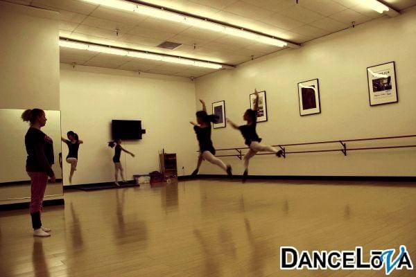 Teen dancers practicing their leaps.