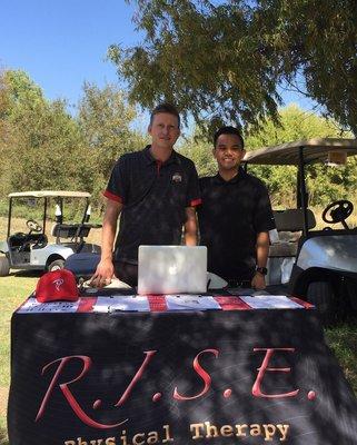 Dr. Hollstegge and Dr. Nguyen sharing their expertise of physical therapy at a community golf event!