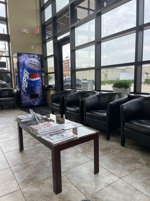 Magazines, soda machine, comfy chairs